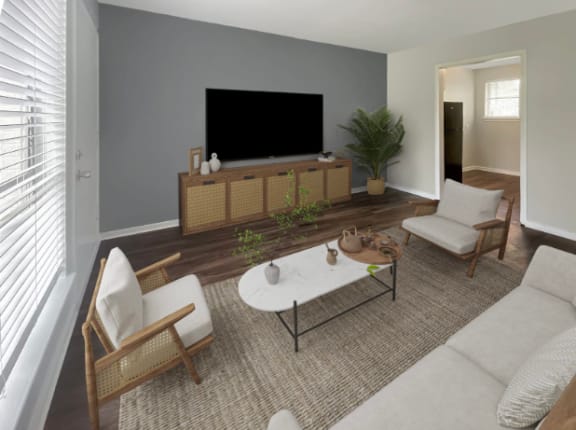 a living room with a couch and a table and a television at The Junction, Tennessee, 38111