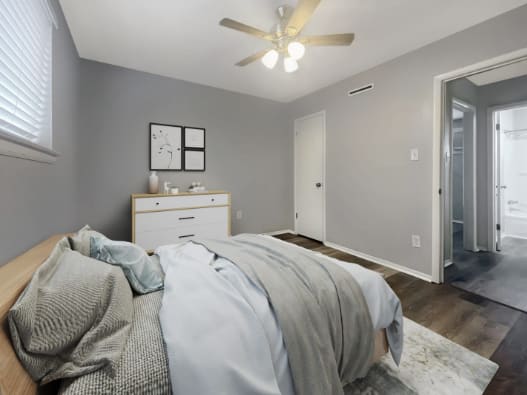 a bedroom with a bed and a ceiling fan at The Junction, Memphis