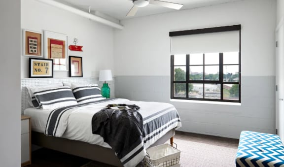 a bedroom with a bed and a window at Parcels at Concourse, Memphis, 38104