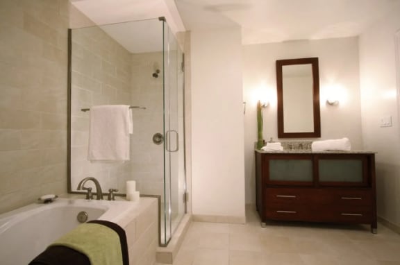 a bathroom with a tub and a sink and a shower  with a tub and a sink and a shower at Metro67, Memphis, TN 38103