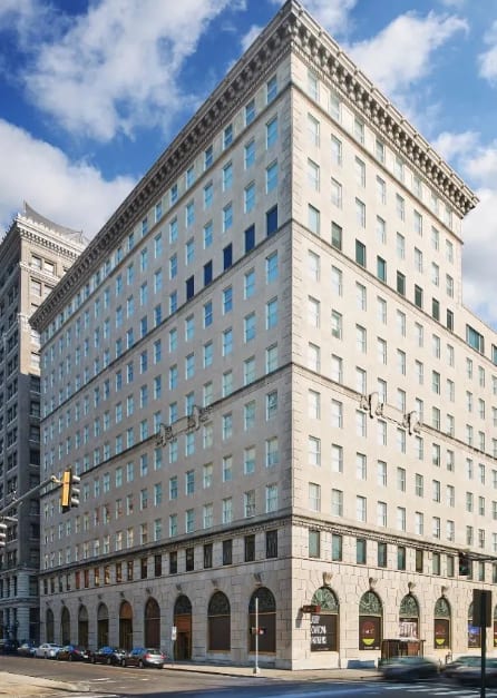 a tall building with many windows and a street in front of it at Metro67, Memphis, 38103