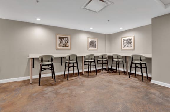 a meeting room with a long table and chairs in the corner at Metro67, Memphis, TN