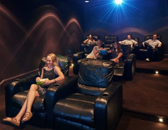 a group of people sitting in leather chairs in a dark room  at Metro67, Memphis, TN
