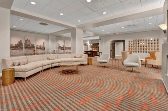 a large living room with couches and chairs and a rug om with couches and chairs and a rug  at Metro67, Memphis, TN