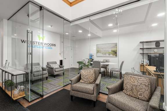 A glass wall with the words "WESTER WOODS APARTMENT HOMES" written on it.