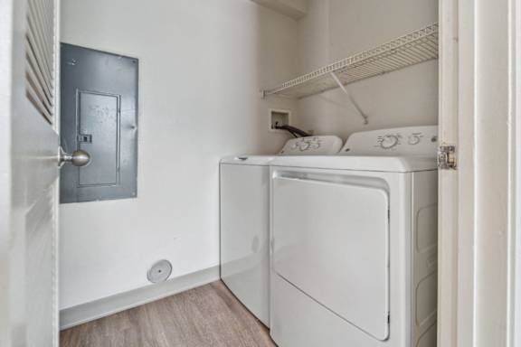 A white fridge in a room with a door on the wall at Monterey Place, New Haven, 06511