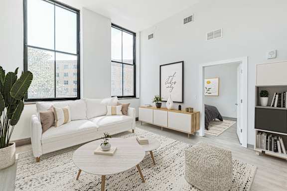 a living room with a white couch and a coffee table