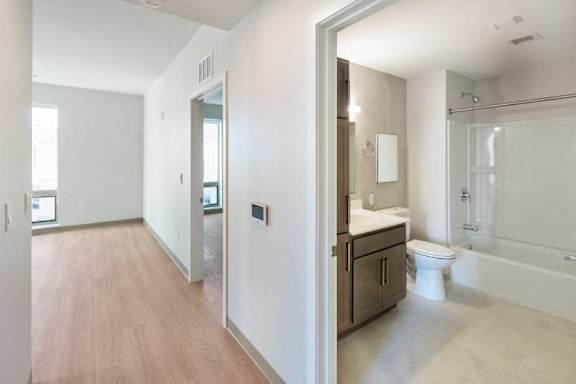 A bathroom with a toilet, sink, and bathtub at Pok Oi Residences, Boston, MA, Massachusetts, 2111