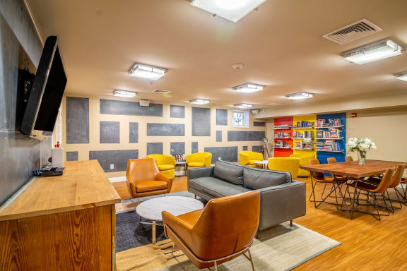 Community Room Area With Couches And Tables Wilber School Apartments at Wilber School Apartments, Sharon, MA, 02067