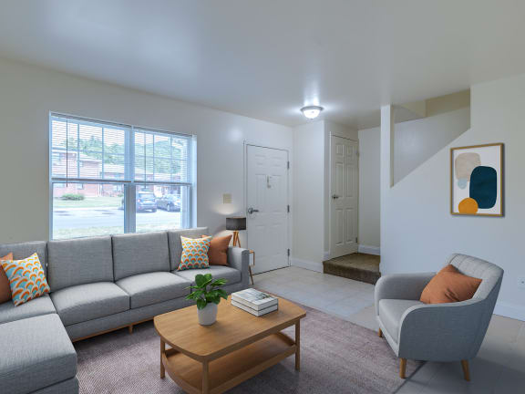a living room with couches chairs and a coffee table at Birchwood Village Apartments, Kingston, New York