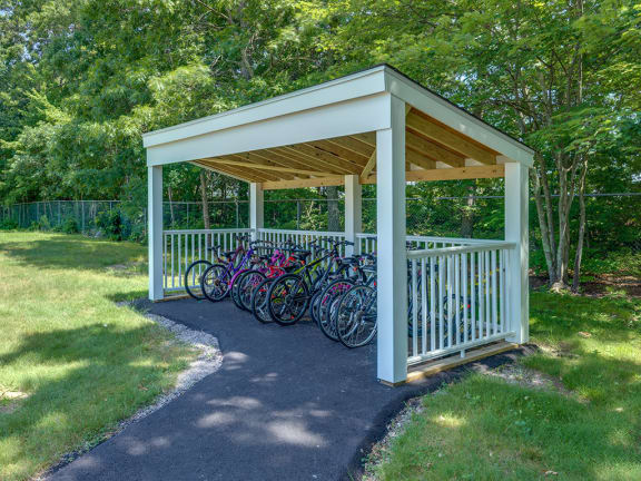 a group of bikes parked under a pavilion at Station Pointe, Mansfield, 02048