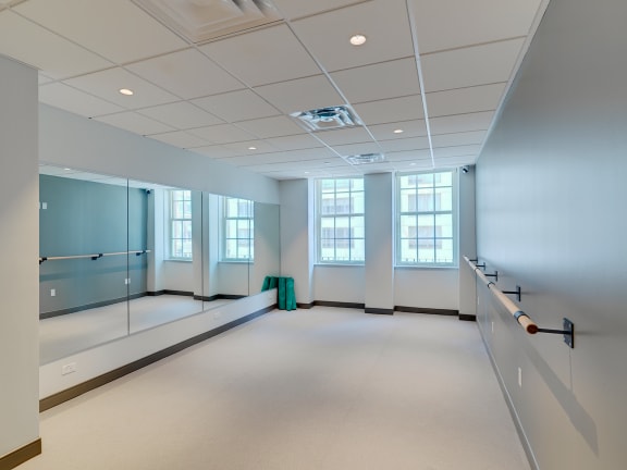 an empty room with a large window and glass doors at 140 Clarendon, Boston, MA