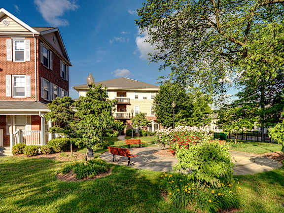 a park with a bench in front of a building at Monterey Place, New Haven, 06511