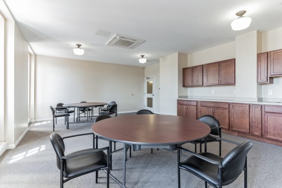 a meeting room with a table and chairs at 13 State Street Apartments, New York