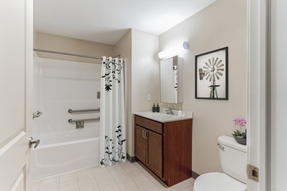a bathroom with a toilet sink and bathtub at 13 State Street Apartments, New York