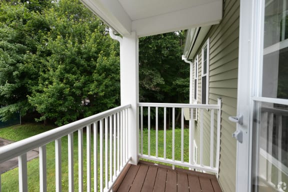 White Porch With Railings With Station Pointe Apartments.