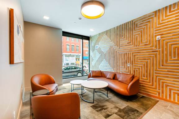 A room with a patterned wall and a couch at Pok Oi Residences, Boston, MA, Massachusetts, 2111