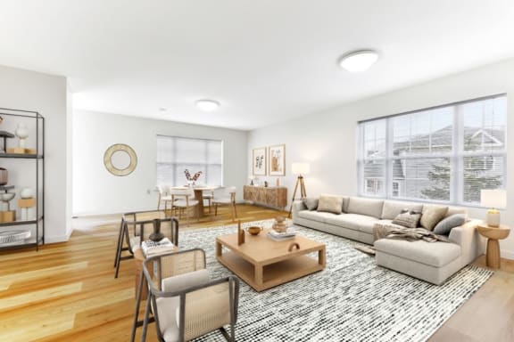 a living room with a couch coffee table and chairs  at Summit Wood Apartments, Watertown, 13601