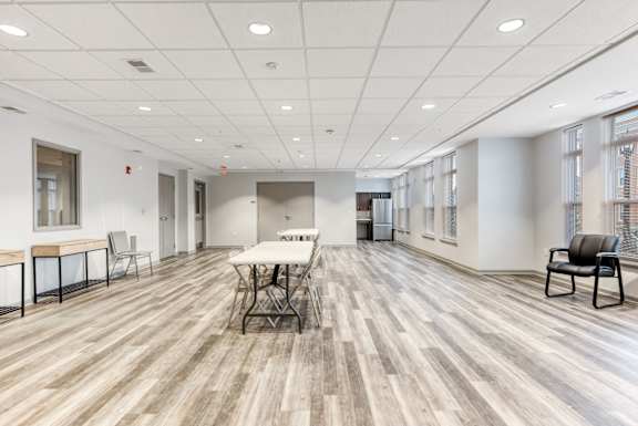 Resident Community Room With Seating and Kitchen at Niagara Square, New York, 14201