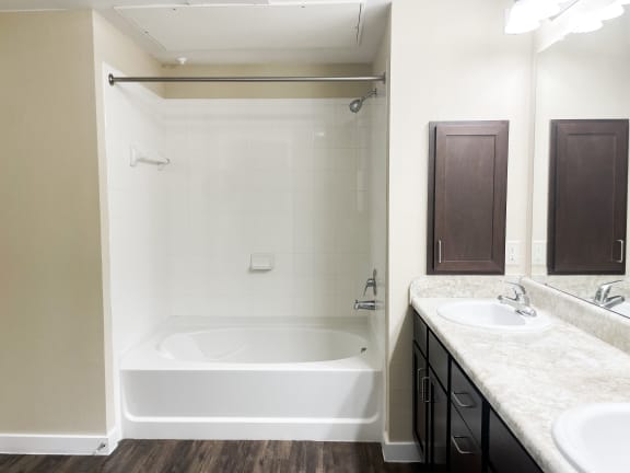 a bathroom with a bathtub and a sink