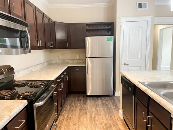 a kitchen at the acadia park apartments in houma, la