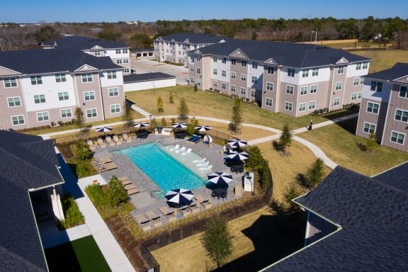 an aerial view of the resort style pool and courtyard at 55 Fifty at Northwest Crossing, Houston, 77092