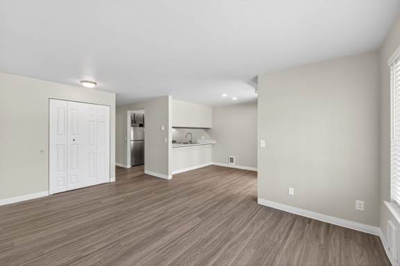 A room with a white door and a white cabinet.
