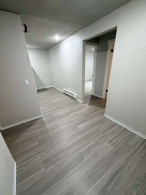A room with a grey floor and white walls.