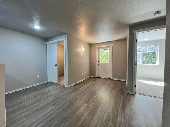 A room with a grey floor and white walls.