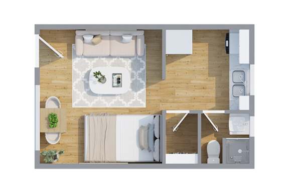 A top-down view of a modern Studio Apartment with a living space with a sofa, coffee table, and kitchen area at Cornerstone Apartments.