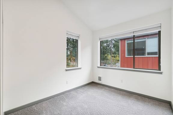 A room with a window and a door.