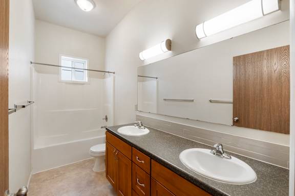 Bathroom with double vanity and shower/tub combo