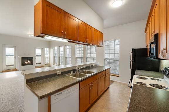 Kitchen with dishwasher, stove/oven, microwave and refrigerator