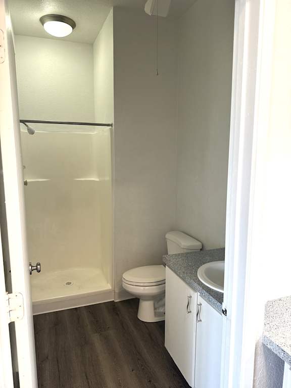 Bathroom with shower, toilet, and vanity in 1-bedroom Olympia Washington apartment