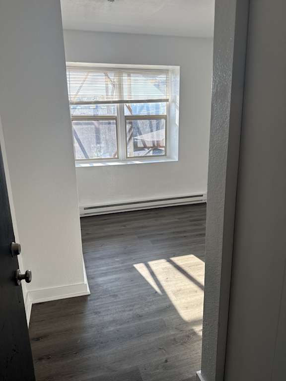 Entry view into living room with large window in Olympia WA apartment