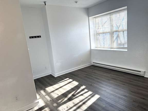 Sunlit living room with large window in Olympia WA 1-bedroom apartment