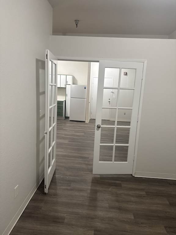 View from bedroom into living area with glass-pane doors in 2 bedroom apartment at The Elks in Olympia WA apartment