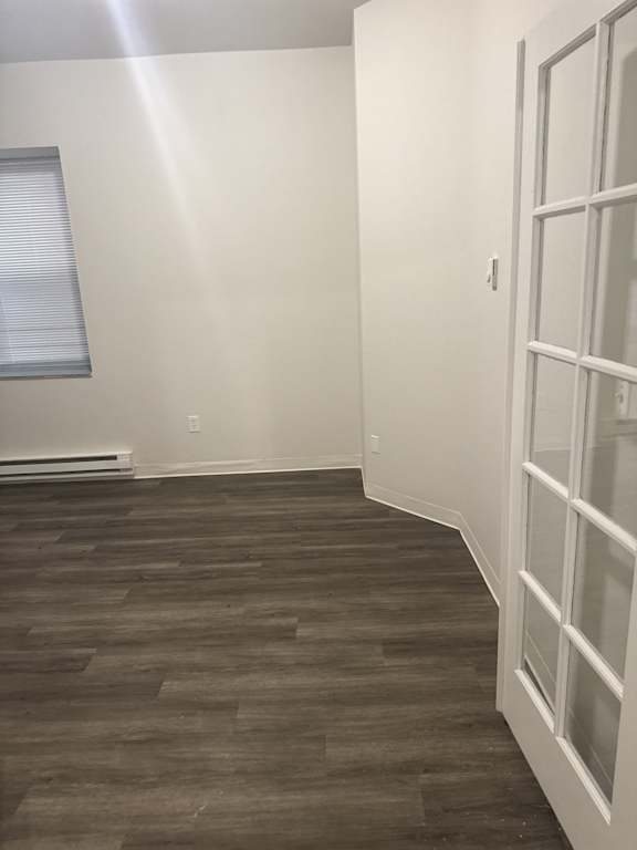 Large bedroom or flex space with vinyl plank flooring in Olympia Washington apartment