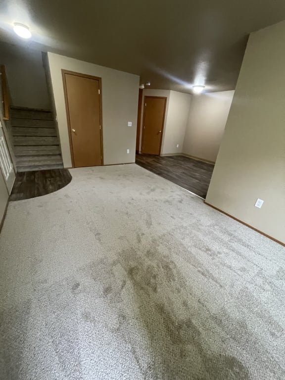 a view from the bottom of a staircase in a building with concrete walls