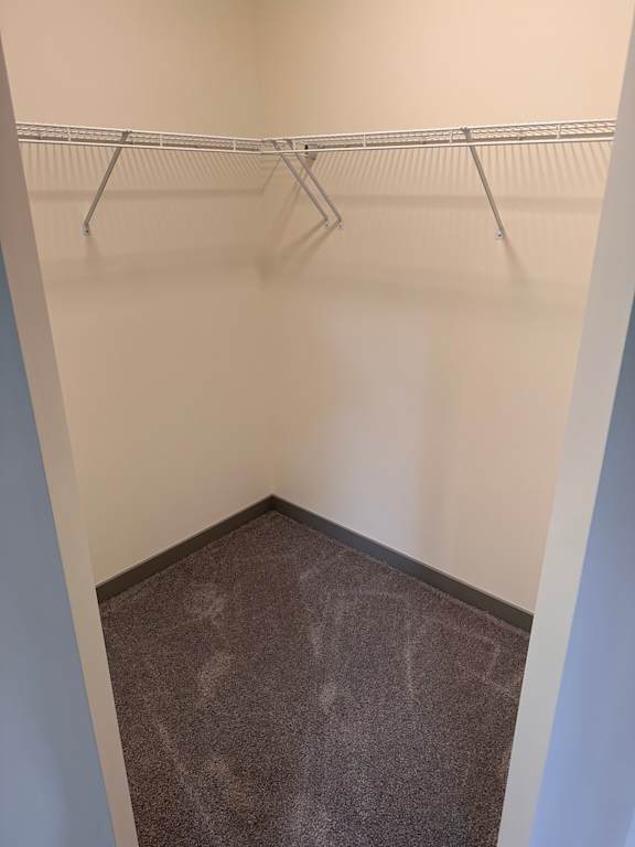 a close up of a wall with a metal shelving unit