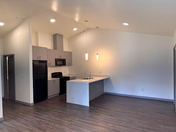 a kitchen and dining area in a 555 waverly unit
