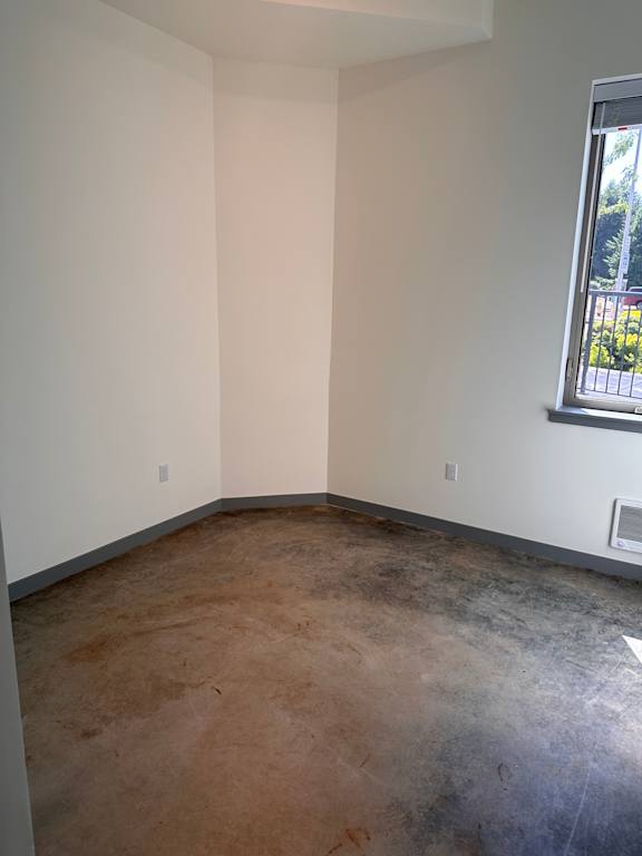 a view of the loft from the top of the stairs