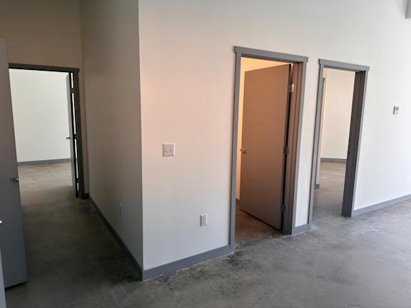 an empty room with three doors
