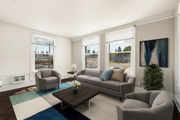 a living room with couches and chairs and a coffee table