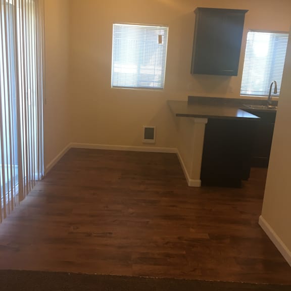 A room with wooden walls and a staircase.