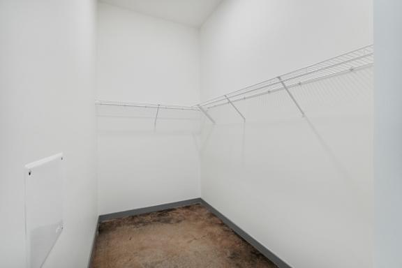 a room with white walls and a concrete floor