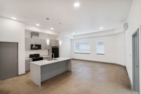 a kitchen and dining area in a 555 waverly unit