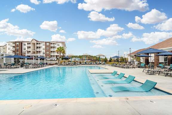 the swimming pool at the resort at governors crossing at The Met Apartment Homes, Hattiesburg, Mississippi