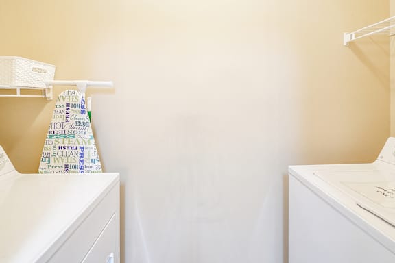 A white ironing board at The Vineyard of Olive Branch Apartment Homes, Mississippi 38654