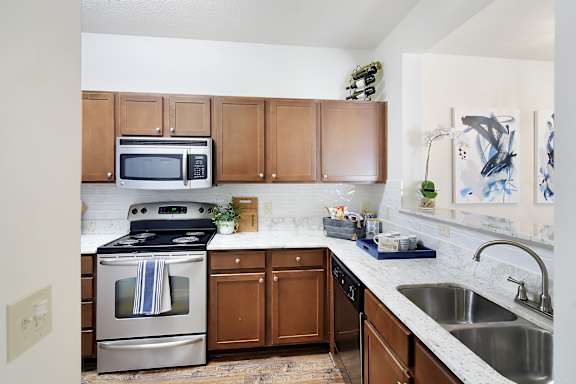 Oven, dishwasher and microwave at Landing at Willow Bayou Apartment Homes in Bossier City, LA